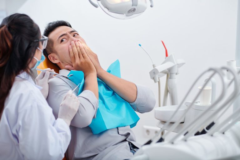 patient-scared-of-dental-treatment-QTDTMF3